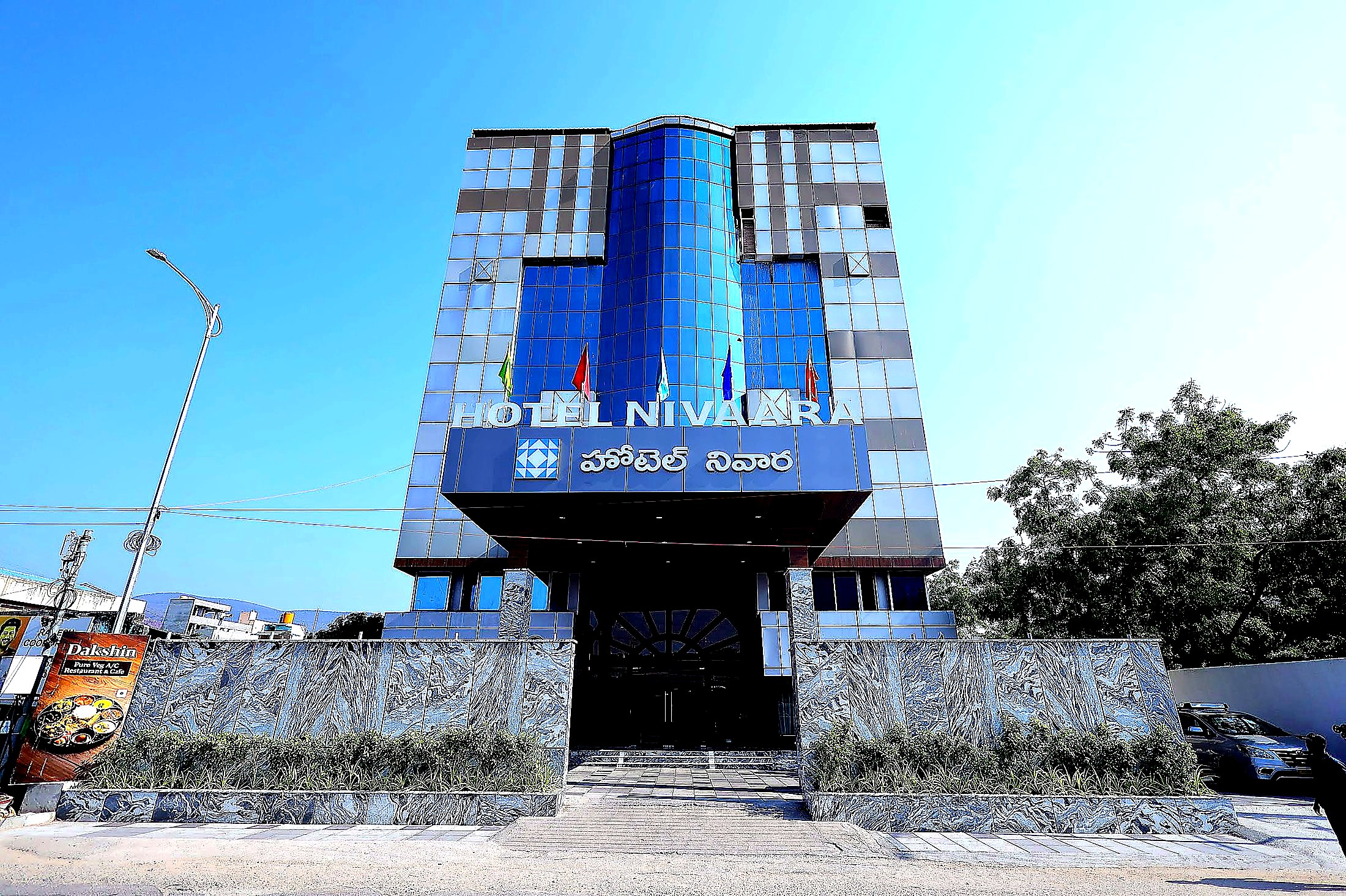 Frontal facade of Hotel Nivaara at dusk