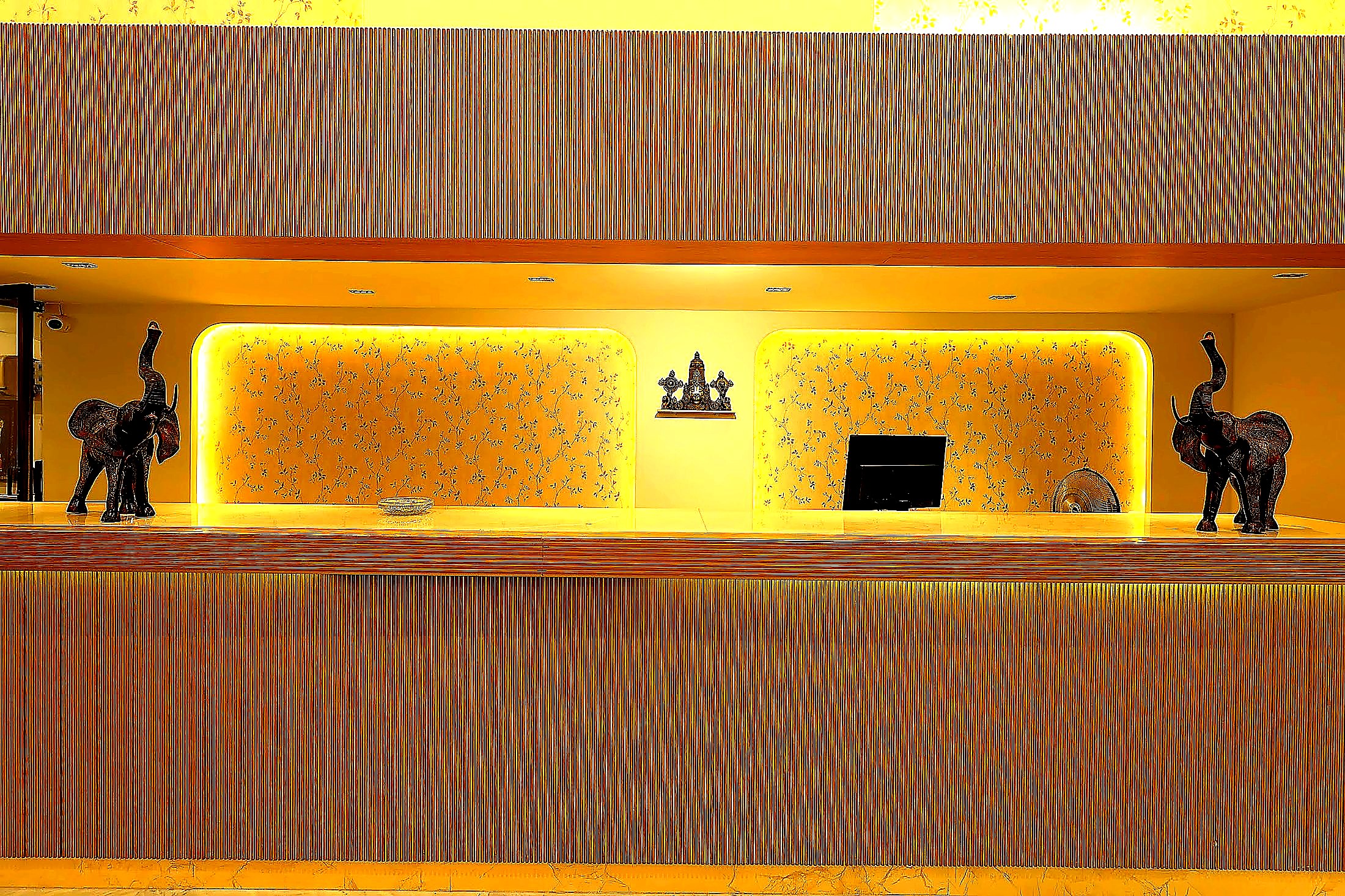 Reception niche with bronze elephant accents