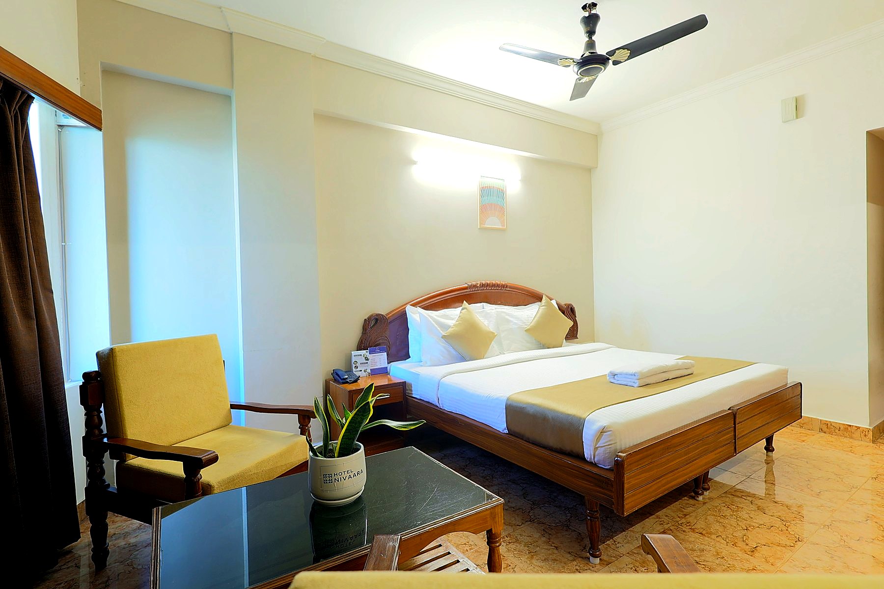 Executive Double room with plush bedding and lounge chairs